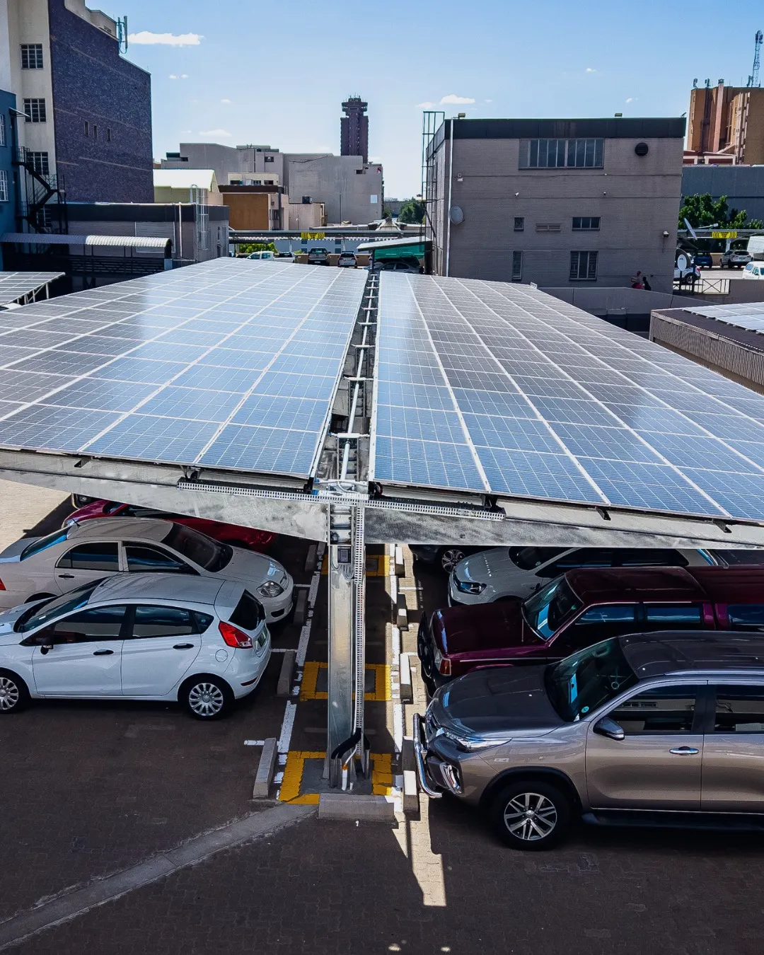 Solar carport mounting system with PV racking structure