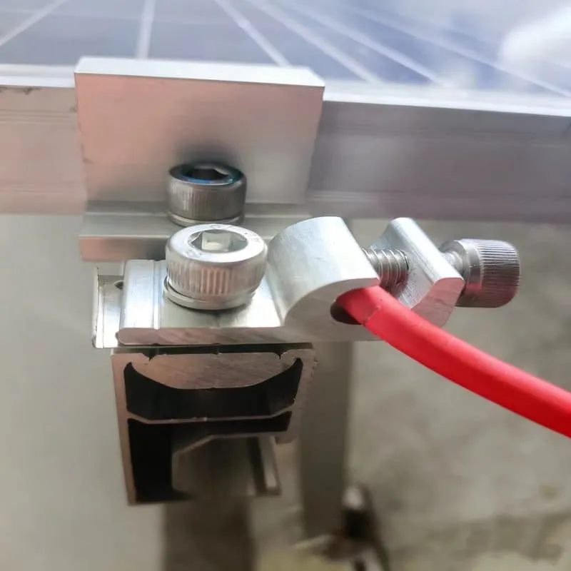 Grounding clip and lug contact interface on an anodized aluminum solar mounting rail