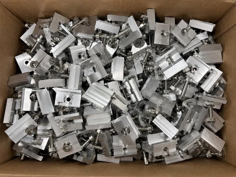 Solar panel mid clamps, end clamps and bolts arranged for carton and project-kit packaging