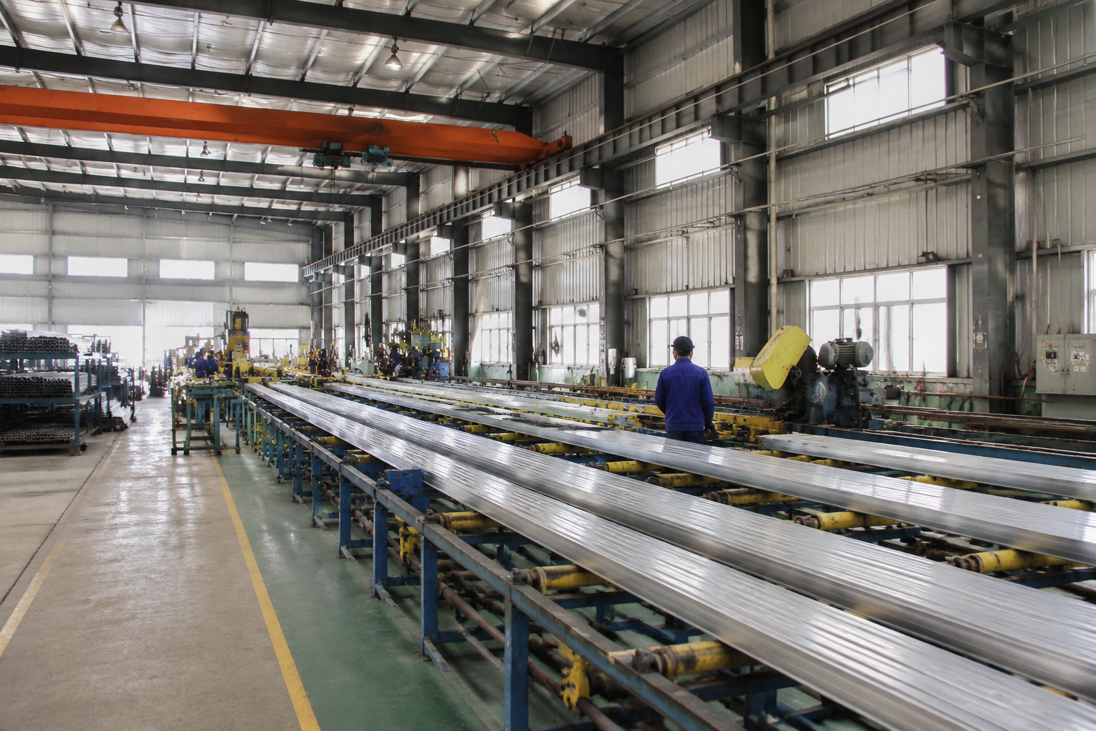 Factory producing solar carport frames and photovoltaic mounting components