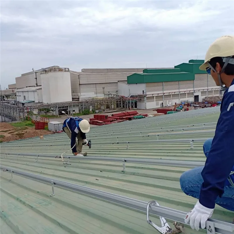 Corrugated roof solar mounting system with long rail, mid clamp and end clamp
