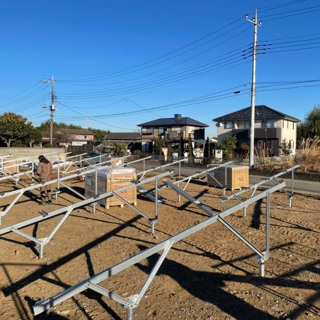 Open-field photovoltaic installation with visible ground posts and mounting rails