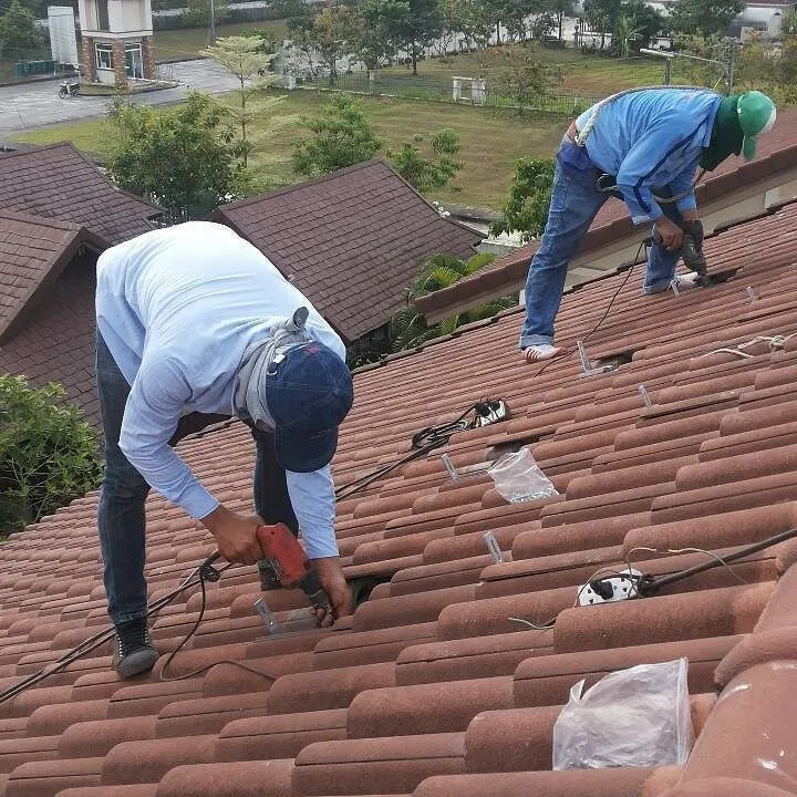 Residential rooftop solar panels installed with roof mounting rails and clamps