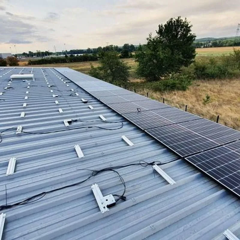 Short solar panel mounting rails on a metal roof with direct roof attachment