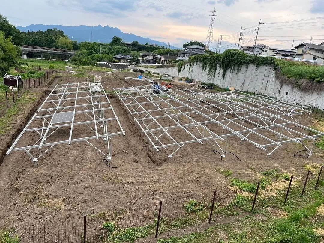 Large-scale ground-mounted solar farm with multiple photovoltaic module rows
