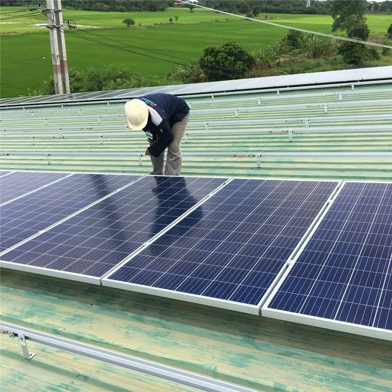 Solar panels mounted on a corrugated metal roof with L feet, hanger bolts, rails and panel clamps