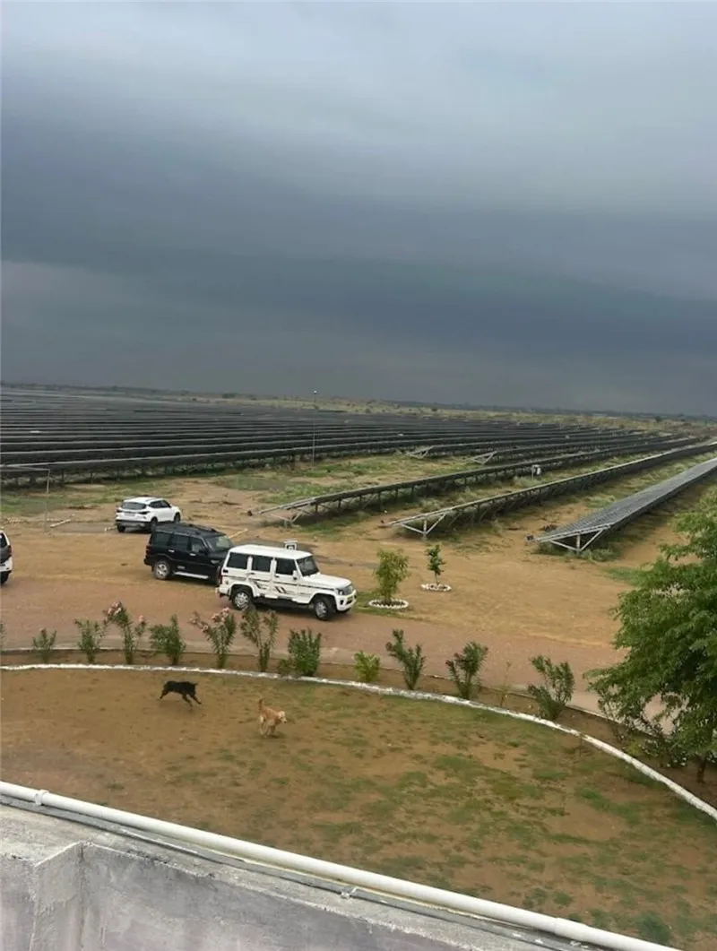 Utility-scale solar farm with fixed-tilt ground mounting structures and pile foundations