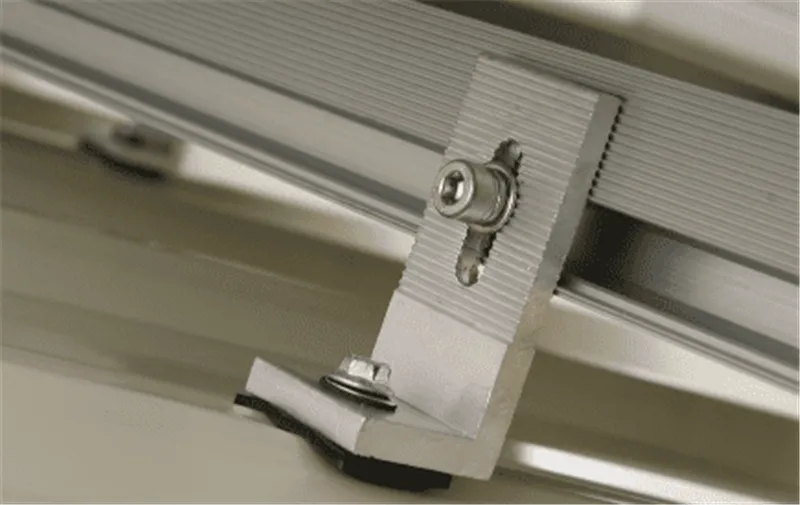 Waterproof sealing detail of a solar hanger bolt and EPDM washer on a corrugated metal roof